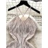 Jumping and wearing a high-end camisole dress with a feminine feel, backless slim fit, mid length sequin tassel dress
