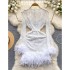 Small dress, high-end dress, luxurious and luxurious, with a sense of luxury. Perspective lace long sleeved feather short style buttocks wrapped dress for women
