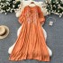 Slightly chubby and slimming dress for women in summer, with a lazy and relaxed style. Loose, flesh blocking, lace up, round neck, lantern sleeves, embroidered over the knee long skirt