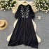 Slightly chubby and slimming dress for women in summer, with a lazy and relaxed style. Loose, flesh blocking, lace up, round neck, lantern sleeves, embroidered over the knee long skirt