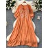 Slightly chubby and slimming dress for women in summer, with a lazy and relaxed style. Loose, flesh blocking, lace up, round neck, lantern sleeves, embroidered over the knee long skirt