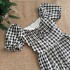 Yang Xiaojuan's French retro black and white checkered waist cinched dress exudes a feminine charm, revealing a slimming effect with bubble sleeves and a long skirt for tea breaks