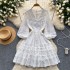 Long sleeved dress for women 2024 new French style design, niche V-neck lace single breasted fluffy short skirt