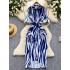 Light luxury French high-end striped printed Polo collar dress for women in summer with a waist cinching design and unique long skirt