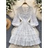 Long sleeved dress for women 2024 new French style design, niche V-neck lace single breasted fluffy short skirt