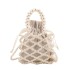 Fairy pearl woven bag spring/summer new 2024 forest style fashionable hollow out personalized hand-held crossbody beach bag trend