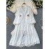 High end temperament dress for women, French retro V-neck, hollowed out lace splicing, waist cinching, slimming effect, single breasted long skirt