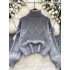 Korean version of simple and high-end knitted high neck sweater for women in autumn and winter, with thick and loose design and loose edges, trendy top