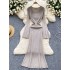 Long sleeved dress for female autumn and winter socialite, slim fit and slimming, round neck knitted skirt, elastic and tight fit, long over the knee woolen dress