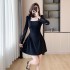 Realistic photo of 2024 autumn new French style black dress with slimming temperament dress paired with rose necklace 8301