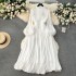 High end dress for women in early spring 2024, new style with a stand up collar, heart mechanism, pleated waist, long version, bubble sleeve dress