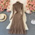 Paired with a coat and paired with a pleated long skirt as a base, this women's knitted dress is slim and semi high necked, knee length woolen dress