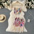 Spring and summer vacation ethnic style hook flower tassel knitted sweater set, women's hanging neck tie vest+short skirt two-piece set