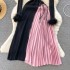 Knitted dress with women's design sense, looped long sleeves, high-end sense, contrasting color splicing, pleated skirt, temperament, slim fit, medium length skirt