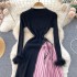 Knitted dress with women's design sense, looped long sleeves, high-end sense, contrasting color splicing, pleated skirt, temperament, slim fit, medium length skirt