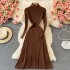 Paired with a coat and paired with a pleated long skirt as a base, this women's knitted dress is slim and semi high necked, knee length woolen dress