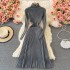 Paired with a coat and paired with a pleated long skirt as a base, this women's knitted dress is slim and semi high necked, knee length woolen dress