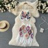 Spring and summer vacation ethnic style hook flower tassel knitted sweater set, women's hanging neck tie vest+short skirt two-piece set