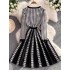 Mingyuan Xiaoxiangfeng Qianniao plaid knitted dress for women in winter, high-quality professional temperament, high waisted umbrella shaped A-line skirt