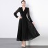 Real time spot black dress with waist cinched pleated skirt, long sleeved flowing V-neck long skirt