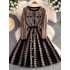 Mingyuan Xiaoxiangfeng Qianniao plaid knitted dress for women in winter, high-quality professional temperament, high waisted umbrella shaped A-line skirt