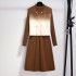 Autumn and winter long sleeved knitted vest two-piece set dress for women with a sense of luxury, color blocking and slimming effect, paired with a sweater and skirt