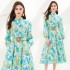 Real shot of niche vacation style single breasted dress with women's print, large swing pockets, elegant temperament, mid length skirt in stock