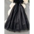 French retro Hepburn style black dress for women with a sense of luxury, featuring a cinched waist, feather patchwork, mesh, fluffy suspender, and long skirt