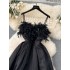 French retro Hepburn style black dress for women with a sense of luxury, featuring a cinched waist, feather patchwork, mesh, fluffy suspender, and long skirt