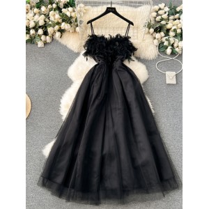 French retro Hepburn style black dress for women with a sense of luxury, featuring a cinched waist, feather patchwork, mesh, fluffy suspender, and long skirt