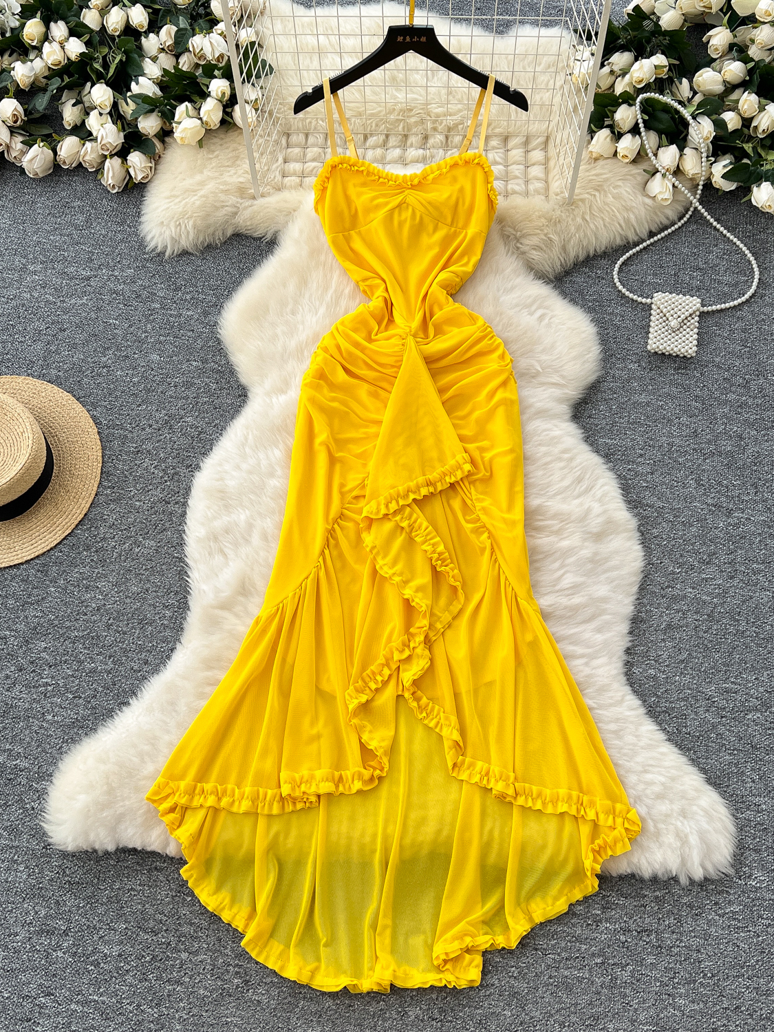 Yellow camisole vacation dress for women in summer 2025, French pleated camisole waist cinched irregular mesh long skirt