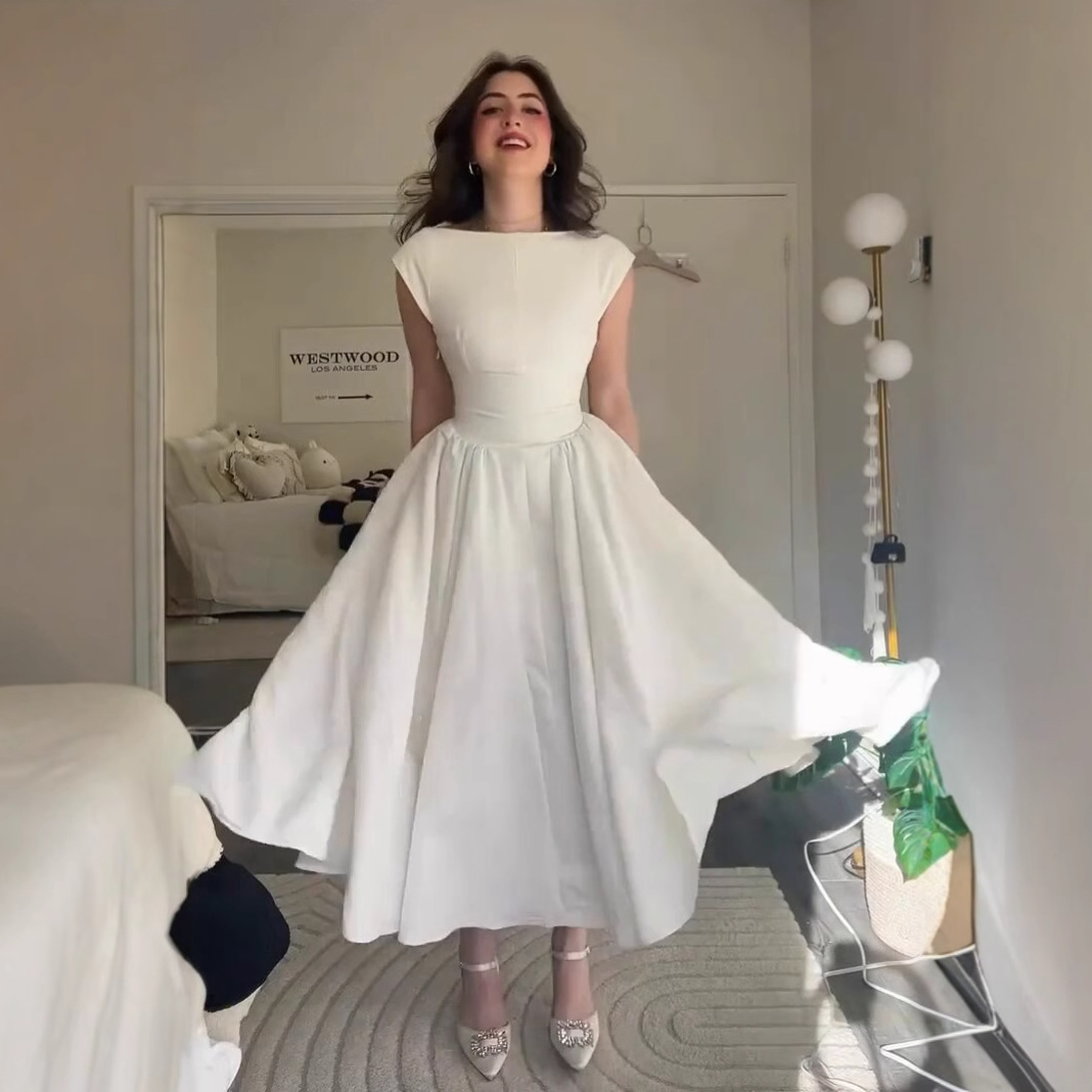 European and American Cross border Women's Clothing 2025 Summer New French Style Slimming and Dazzling Open Back A-line Dress