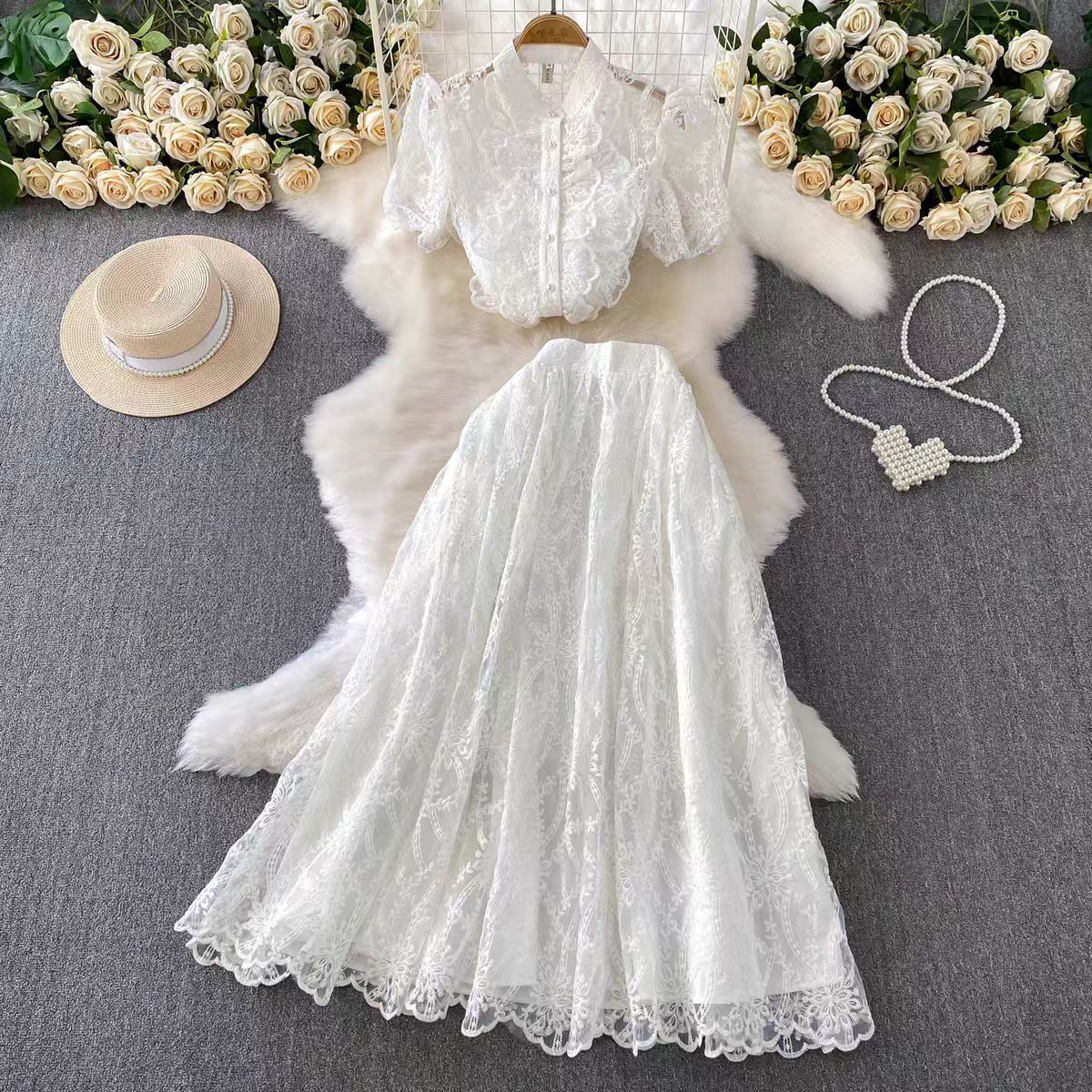 French style women's summer outfit with a high-end feel, featuring lace, black fungus edges, bubble sleeves, embroidered top, and a high waisted, swinging skirt