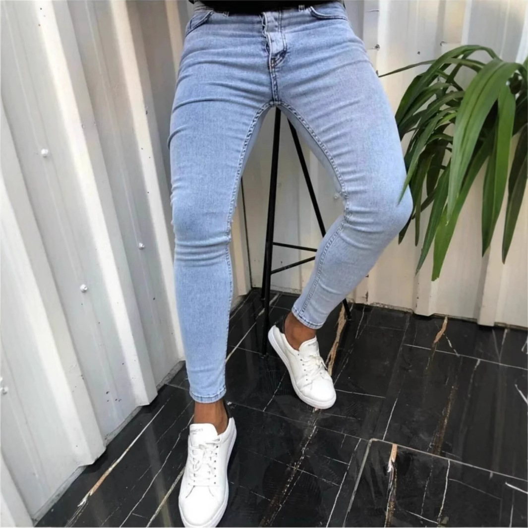 European and American men's new minimalist perforated commuting denim pants with slim fit and small feet, trendy and handsome jeans