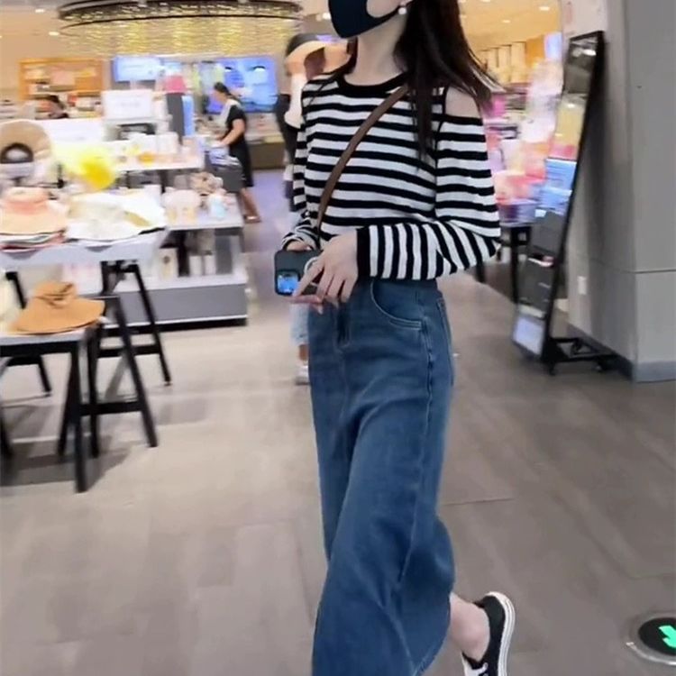 Black and white striped long sleeved knitted sweater for women in autumn 2023 new women's clothing, hollowed out thin loose T-shirt, off shoulder top