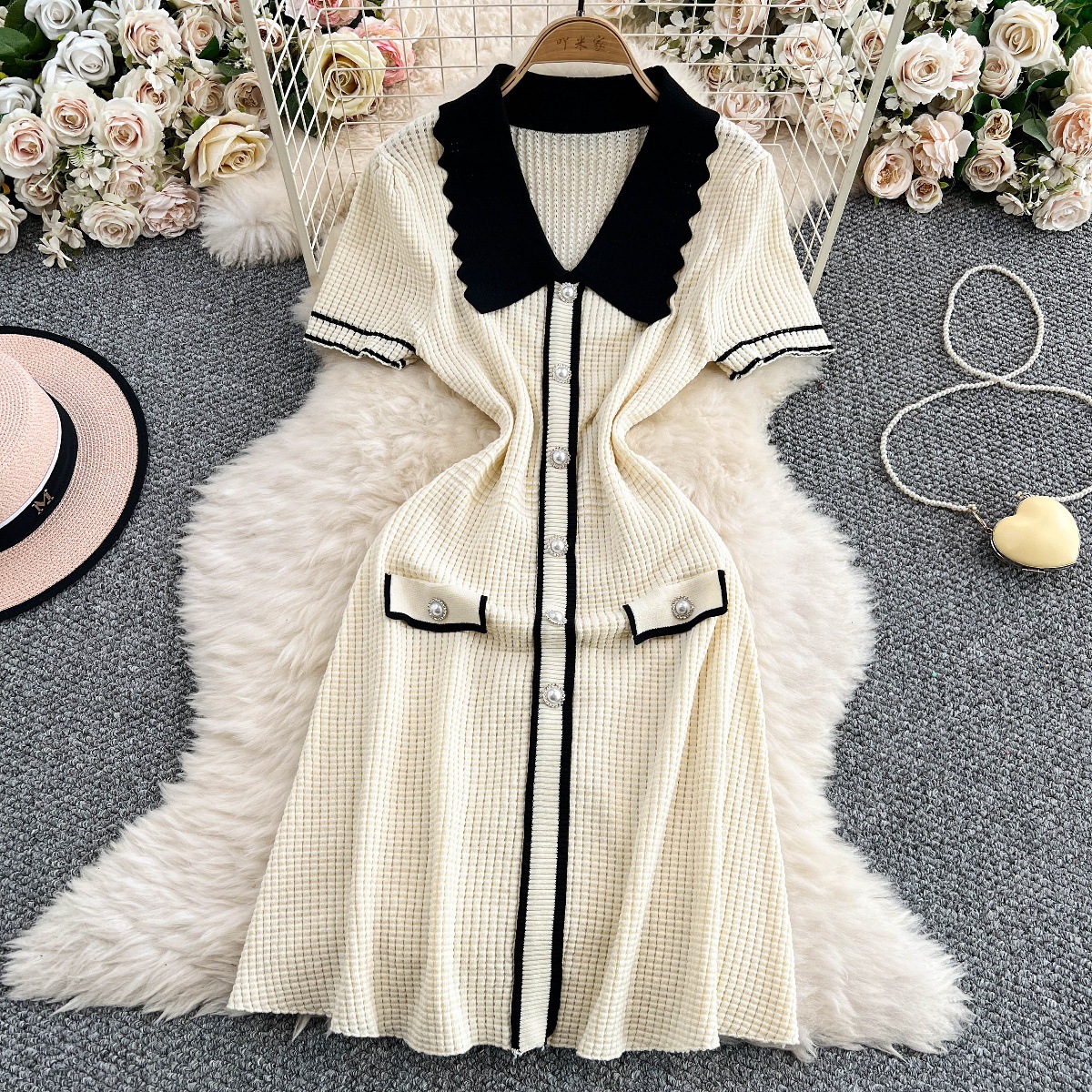 Temperament contrasting doll neck short sleeved knitted dress for women with a niche design sense, single breasted slim fit and slimming mid length skirt Temperament contrasting doll neck short sleeved knitted dress for women with a niche design sense, single breasted slim fit and slimming mid length skirt