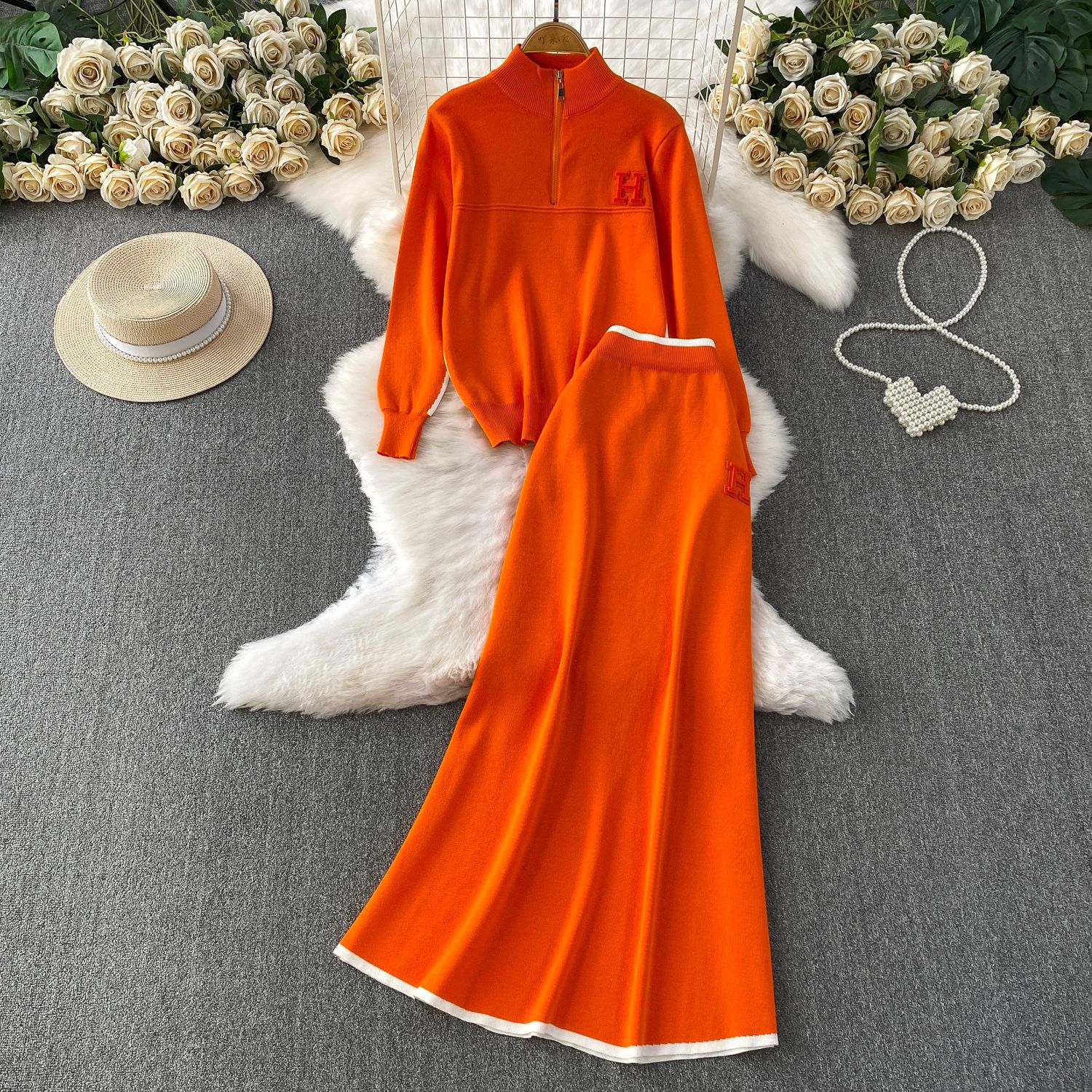 Autumn and winter slimming look, wearing a half high neck long sleeved knitted sweatshirt with a zipper and contrasting high waist mid length skirt set