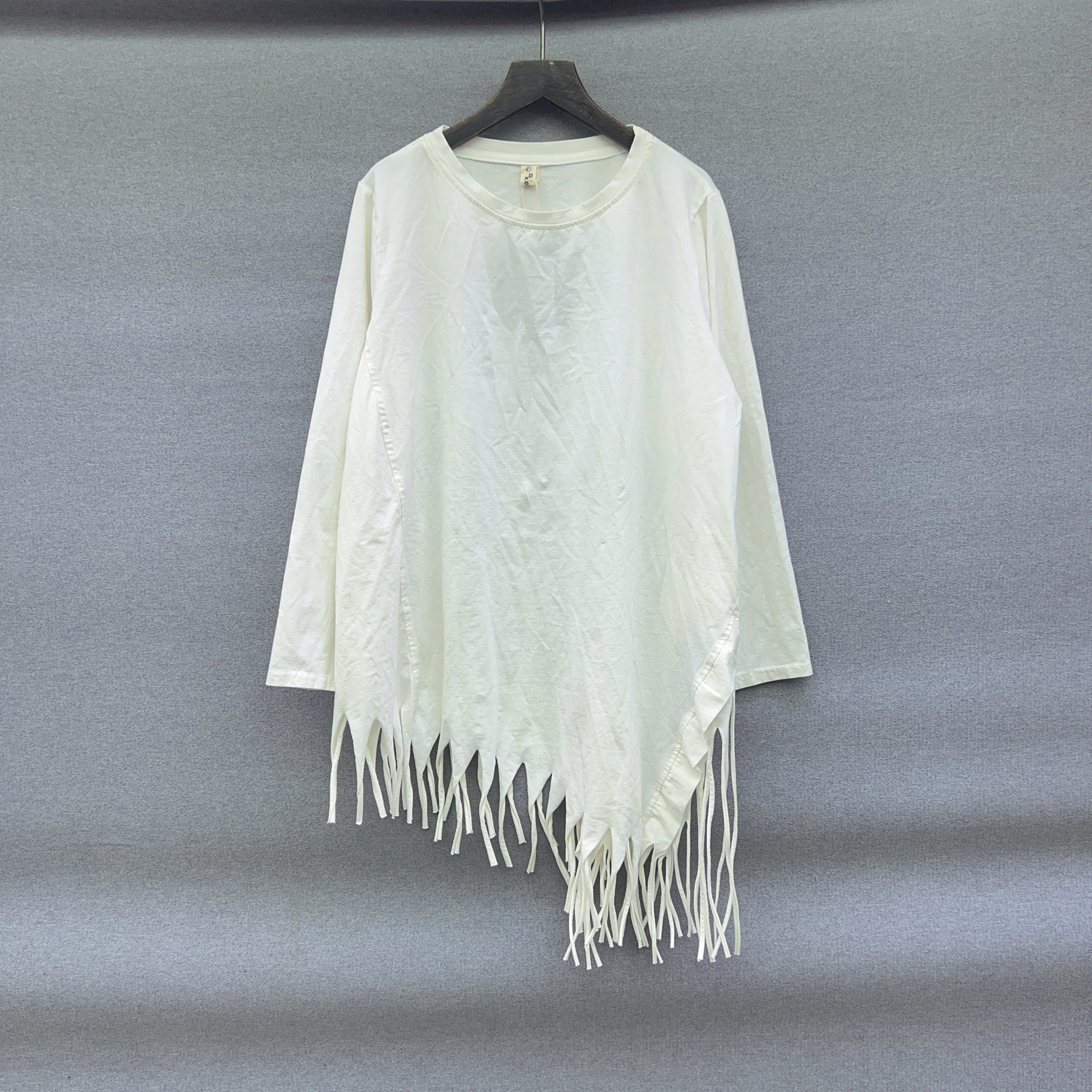 Personalized niche diagonal tassel long sleeved bamboo cotton solid color long sleeved T-shirt, mid to long base top, women's spring and autumn trend