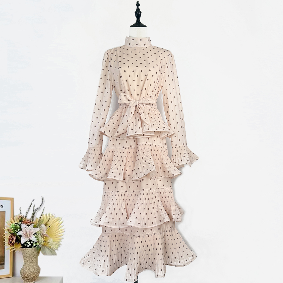 Real shot of an elegant retro polka dot trumpet long sleeved stand up collar lace up pleated ruffle edge dress in Australia, medium length