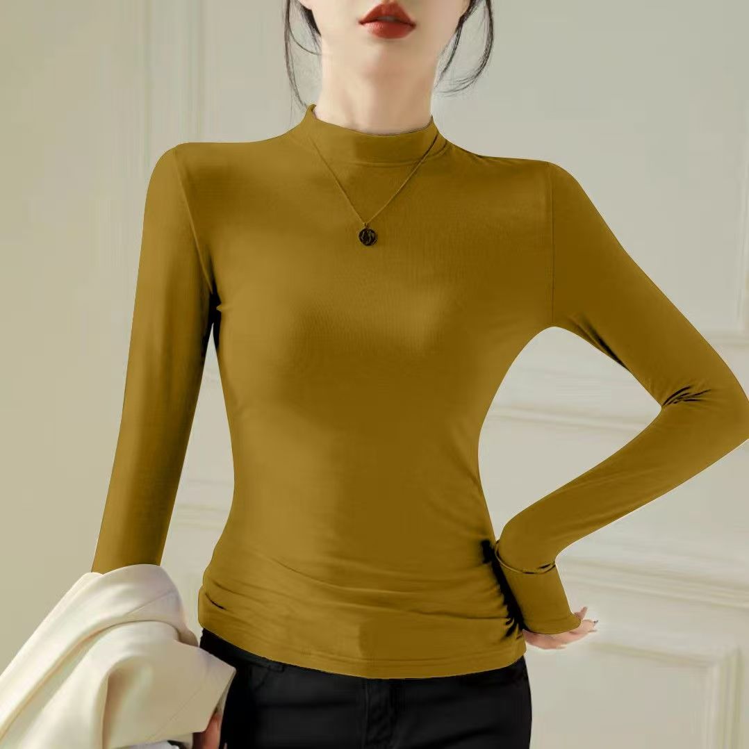 Slimming and slimming long sleeved T-shirt for women in autumn and winter 2025, with a niche and casual design, versatile temperament, round neck base shirt Slimming and slimming long sleeved T-shirt for women in autumn and winter 2025, with a niche and casual design, versatile temperament, round neck base shirt