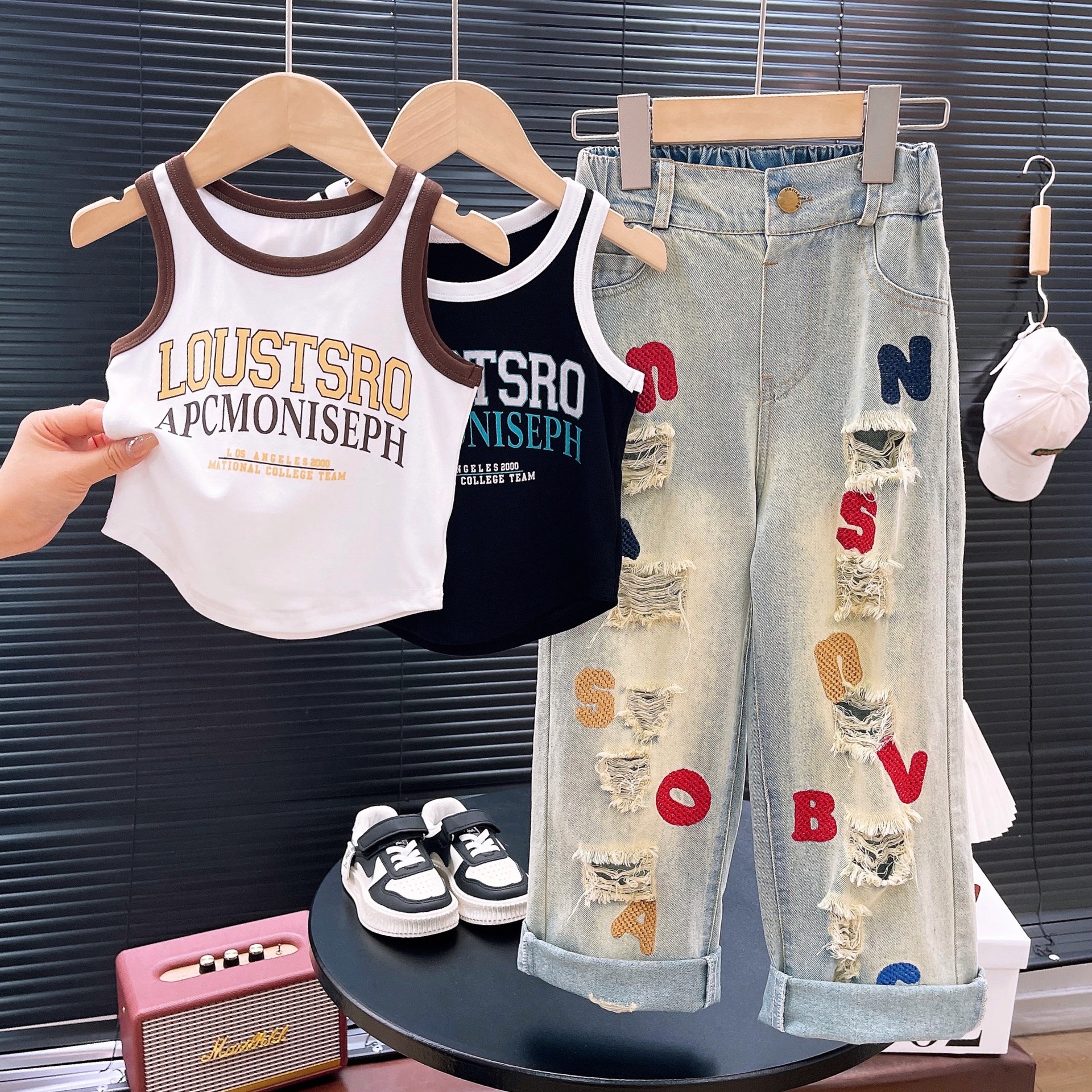 Ancorelala 2024 Spring/Summer Girls' Set, featuring a stylish T-shirt with perforated letters and embroidered jeans