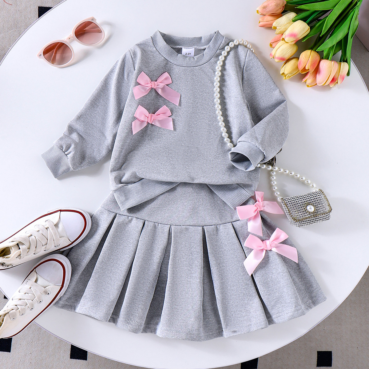 Cross border Spring and Autumn new casual girls' solid color bow round neck long sleeved top with pleated skirt set