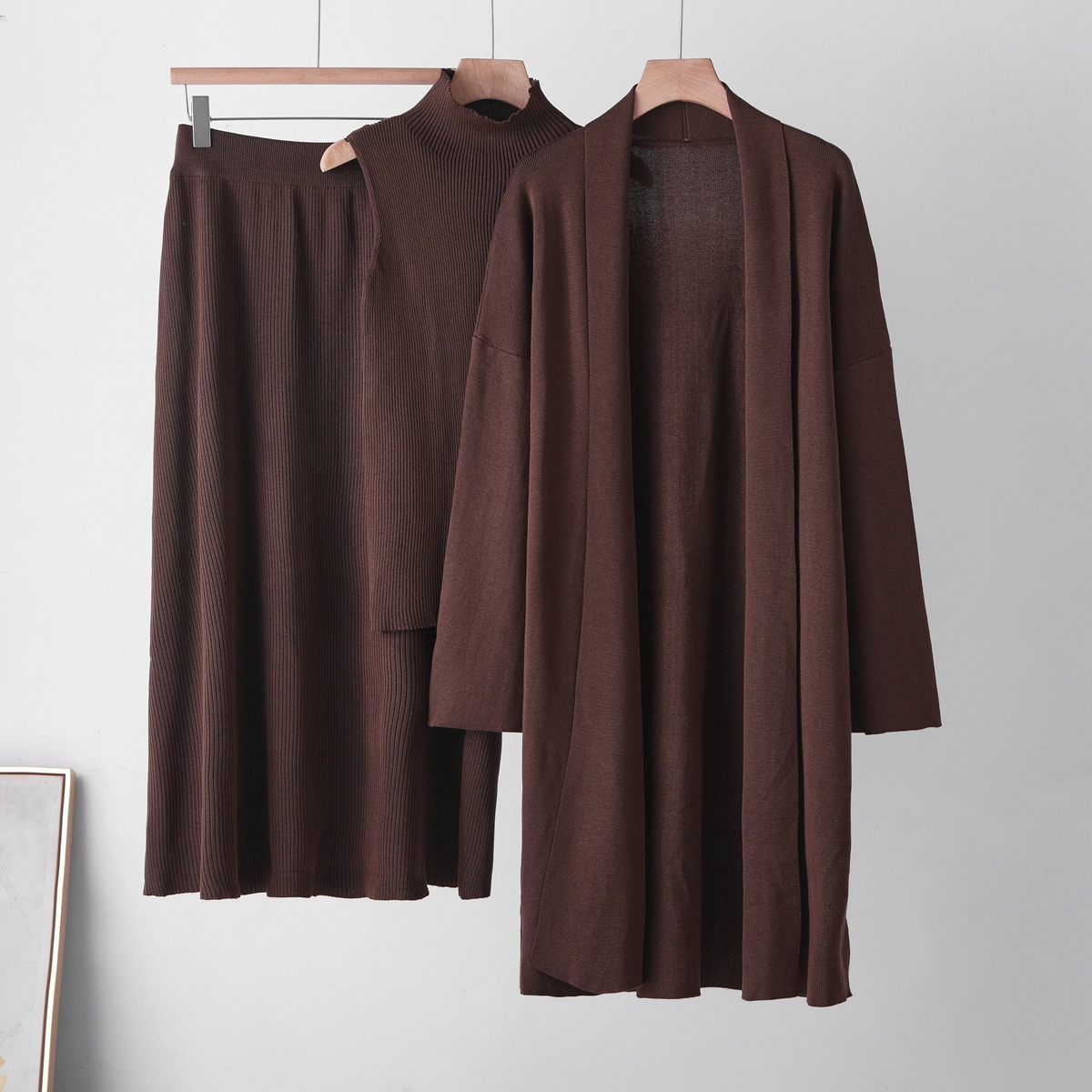 Cross border casual knitted cardigan set for women's autumn and winter new style lazy loose jacket vest half skirt three piece set Cross border casual knitted cardigan set for women's autumn and winter new style lazy loose jacket vest half skirt three piece set