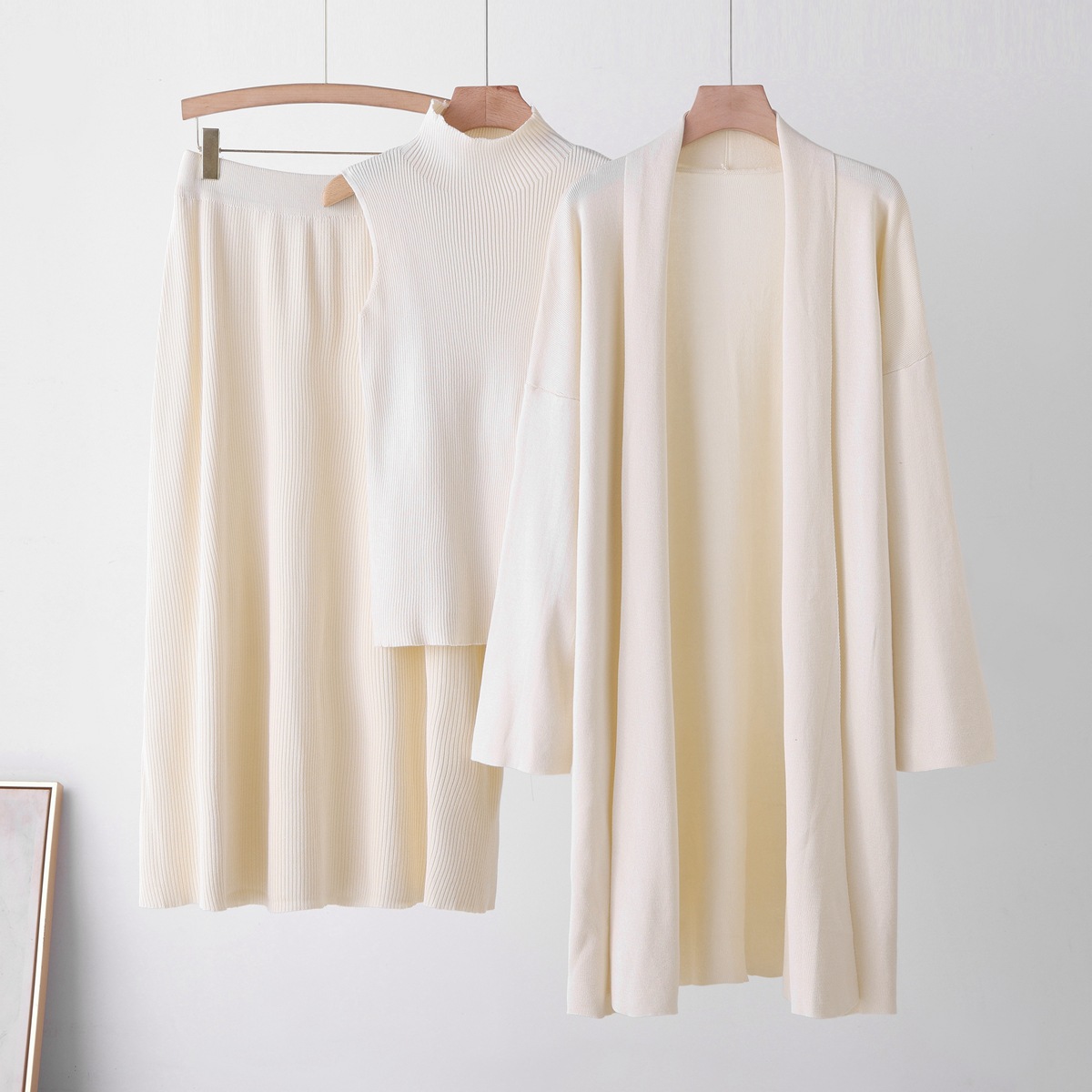 Cross border casual knitted cardigan set for women's autumn and winter new style lazy loose jacket vest half skirt three piece set Cross border casual knitted cardigan set for women's autumn and winter new style lazy loose jacket vest half skirt three piece set