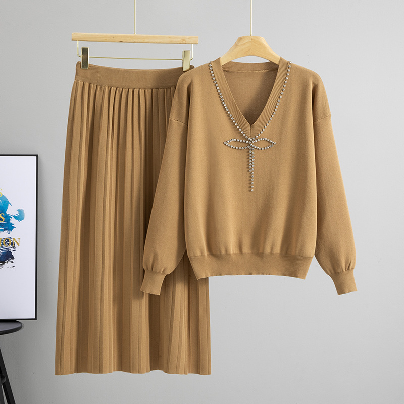 Cross border spring and autumn age reducing bow tie nail diamond embellishment heavy industry V-neck solid color knitted sweater pleated long skirt set for women