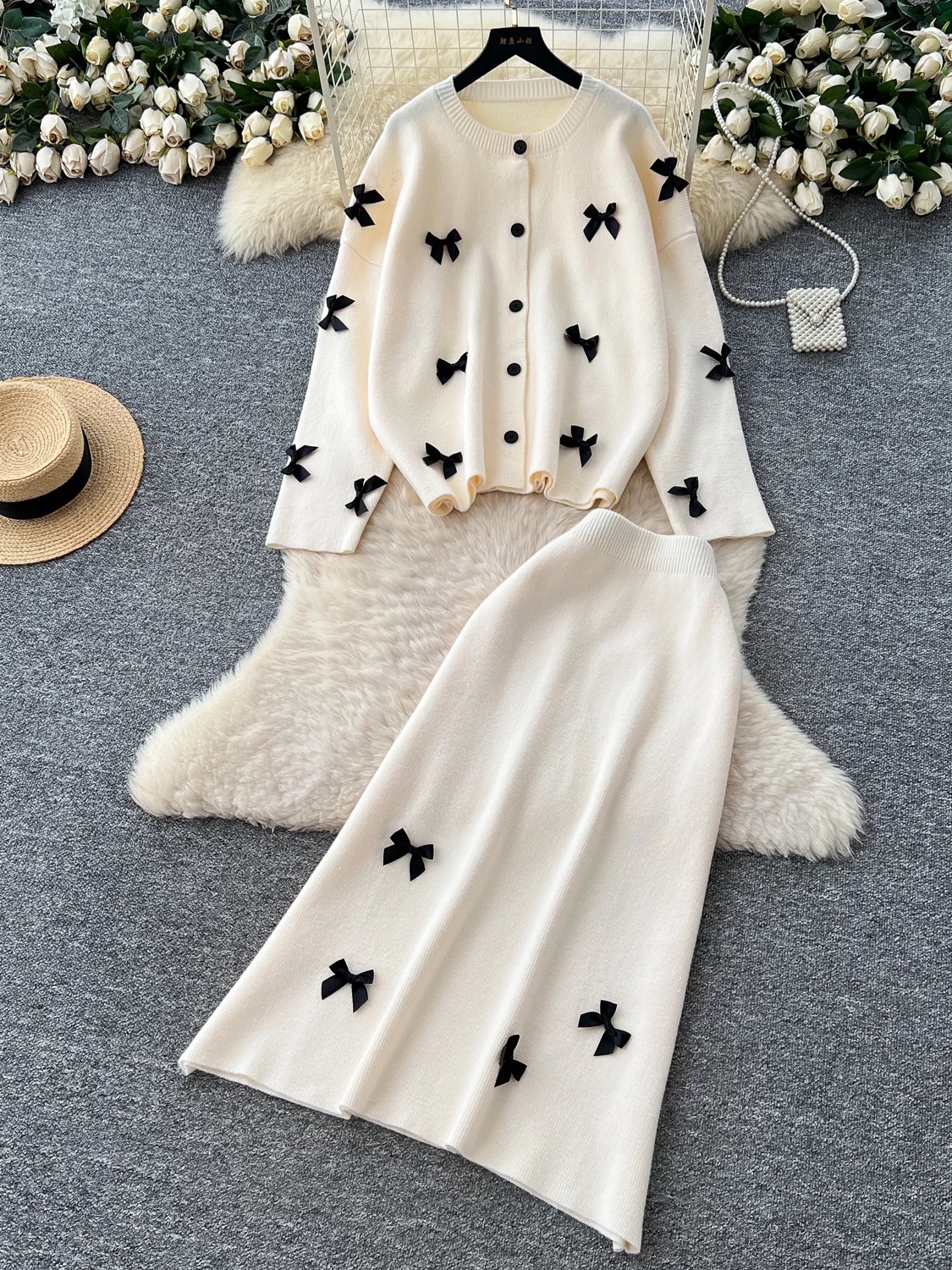 Two piece high-end sweater set for women in autumn and winter, lazy style, loose and casual, bow tie, long sleeved knitted top, half skirt