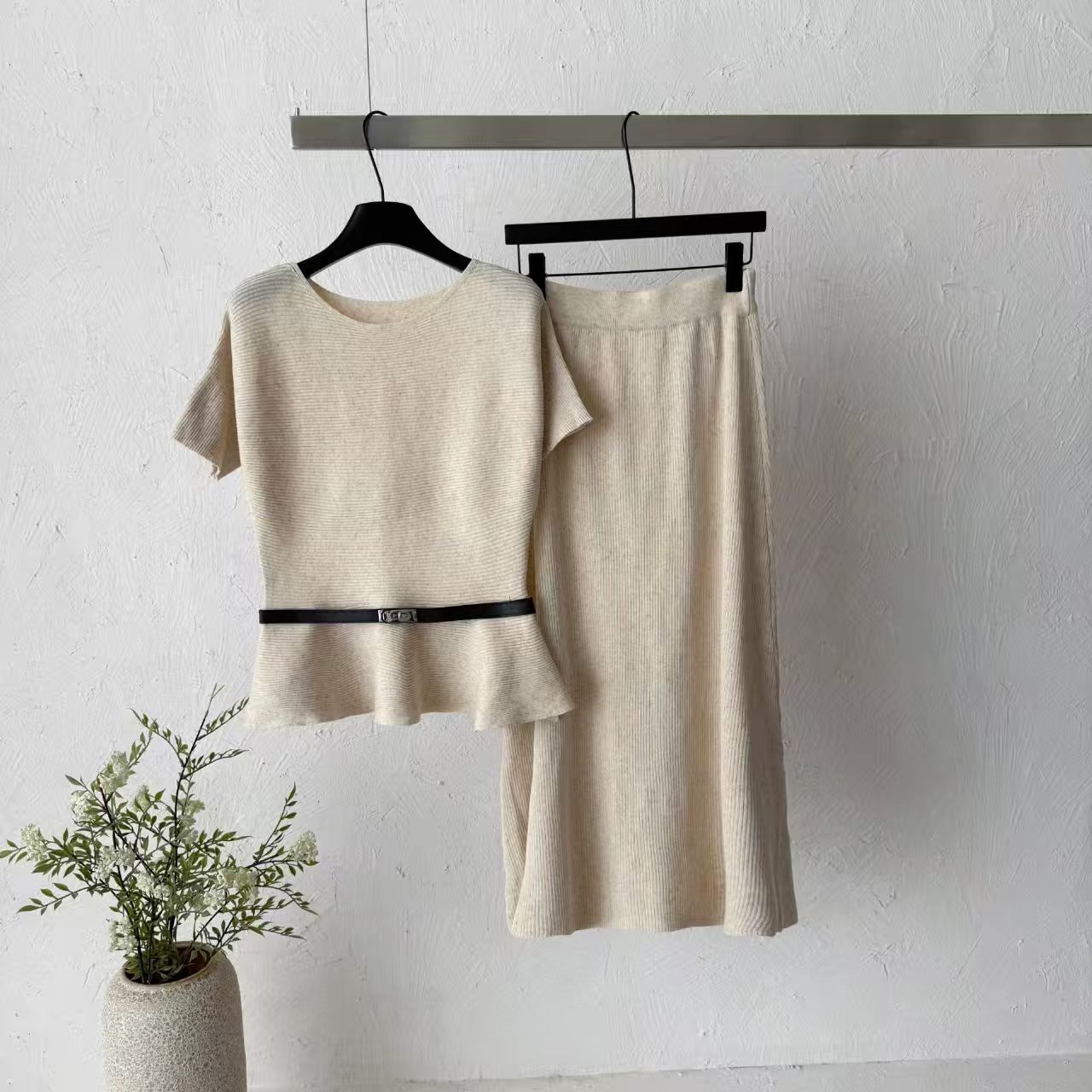 2026 new pit stripe knitted suit women's waist cinched ruffle edge top high waist straight tube half skirt two-piece set temperament 2026 new pit stripe knitted suit women's waist cinched ruffle edge top high waist straight tube half skirt two-piece set temperament