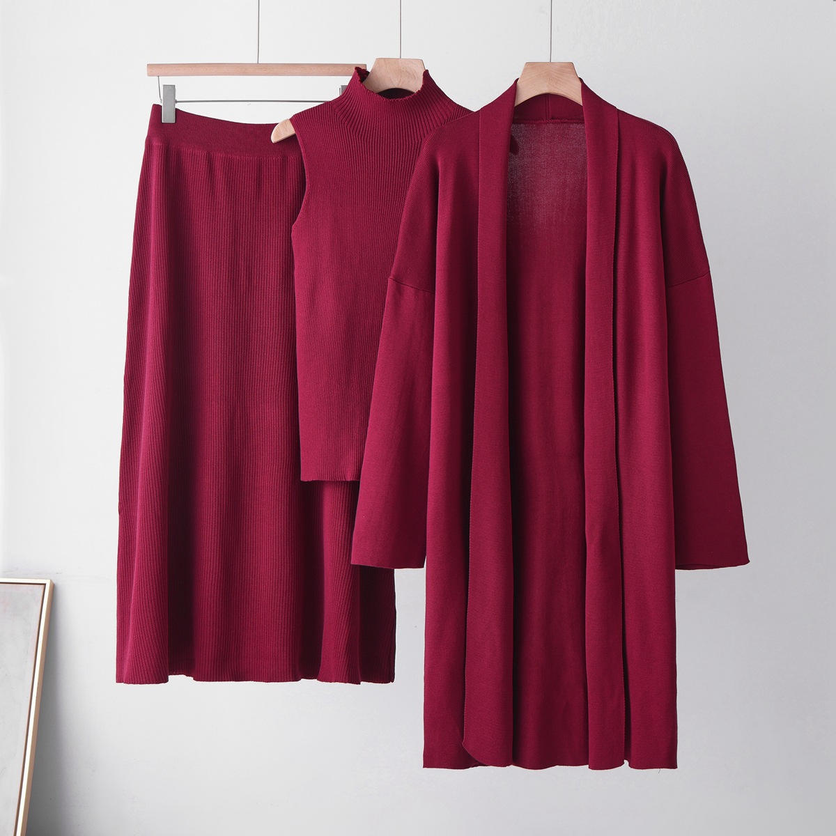Cross border casual knitted cardigan set for women's autumn and winter new style lazy loose jacket vest half skirt three piece set Cross border casual knitted cardigan set for women's autumn and winter new style lazy loose jacket vest half skirt three piece set