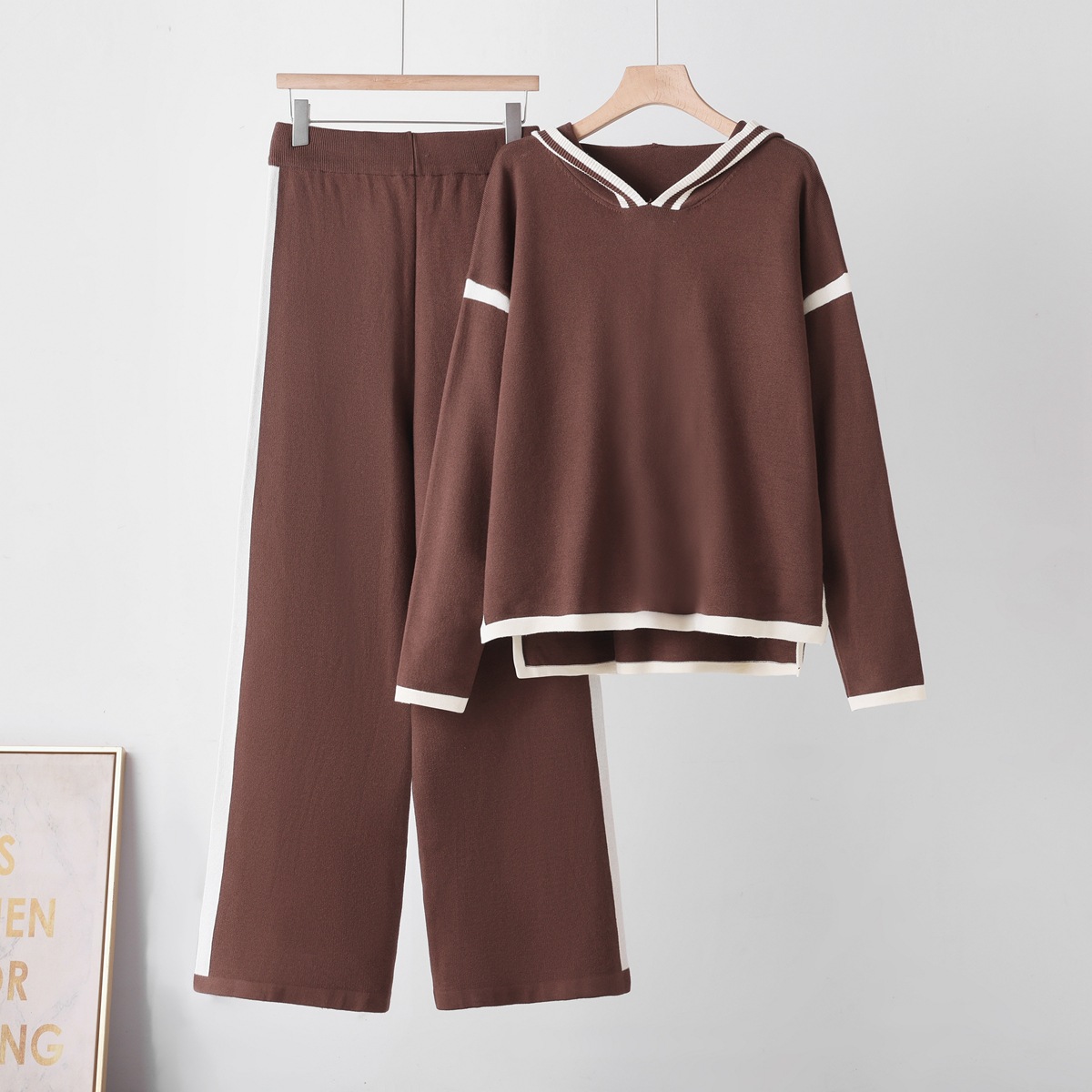 Cross border fashion color blocked hooded knitted suit 2026 women's loose temperament slimming sweater wide leg pants two-piece set Cross border fashion color blocked hooded knitted suit 2026 women's loose temperament slimming sweater wide leg pants two-piece set