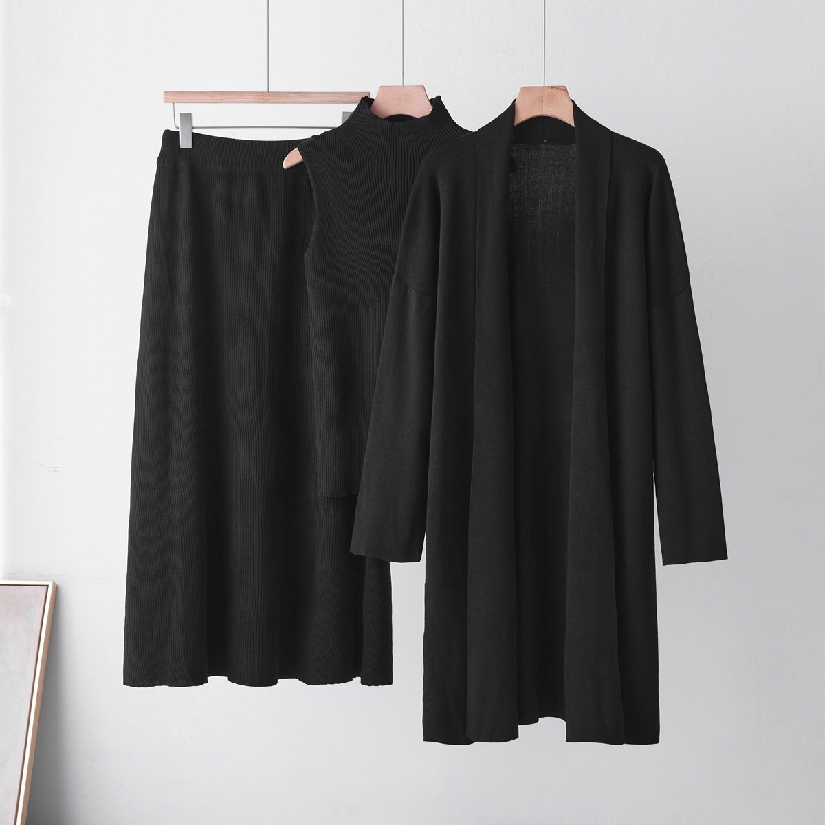 Cross border casual knitted cardigan set for women's autumn and winter new style lazy loose jacket vest half skirt three piece set Cross border casual knitted cardigan set for women's autumn and winter new style lazy loose jacket vest half skirt three piece set